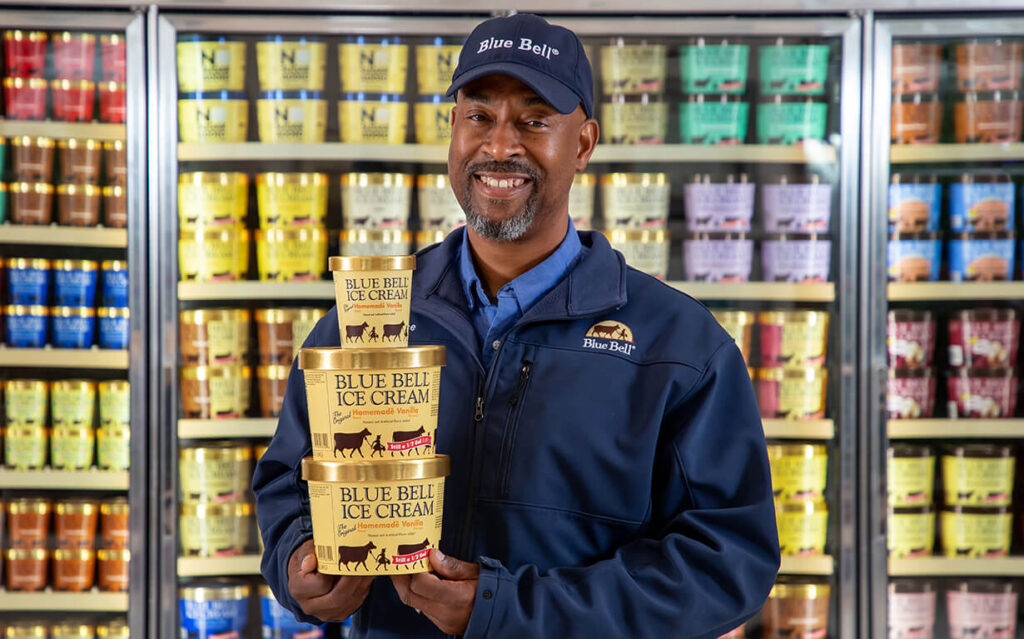 Blue Bell Employee Merchandising Blue Bell employee stocking ice cream at a grocery store