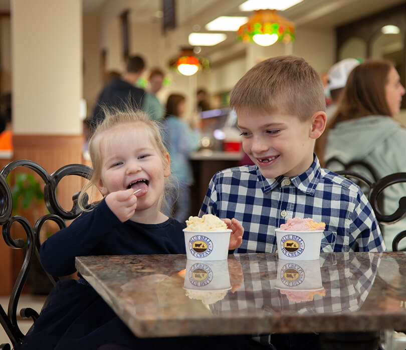 Kids eating ice cream in the Brenham parlor Young boy and girl eating ice cream in the ice cream parlor